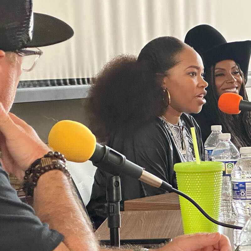 Raina Simone and June Ambrose speaking at Hip Hop conference