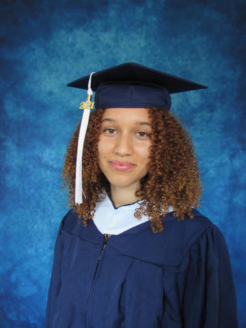 Environmental studies graduate, Audre'ana Ellis poses for gradation photo.